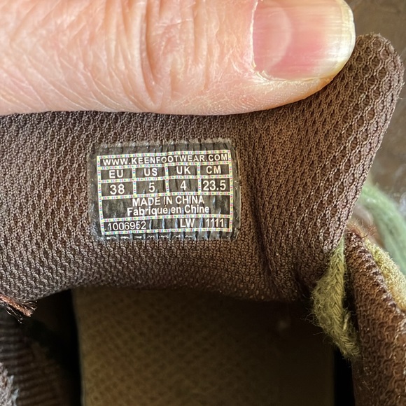 Keen hiking shoes in green and brown with orange stitching. - Picture 11 of 12